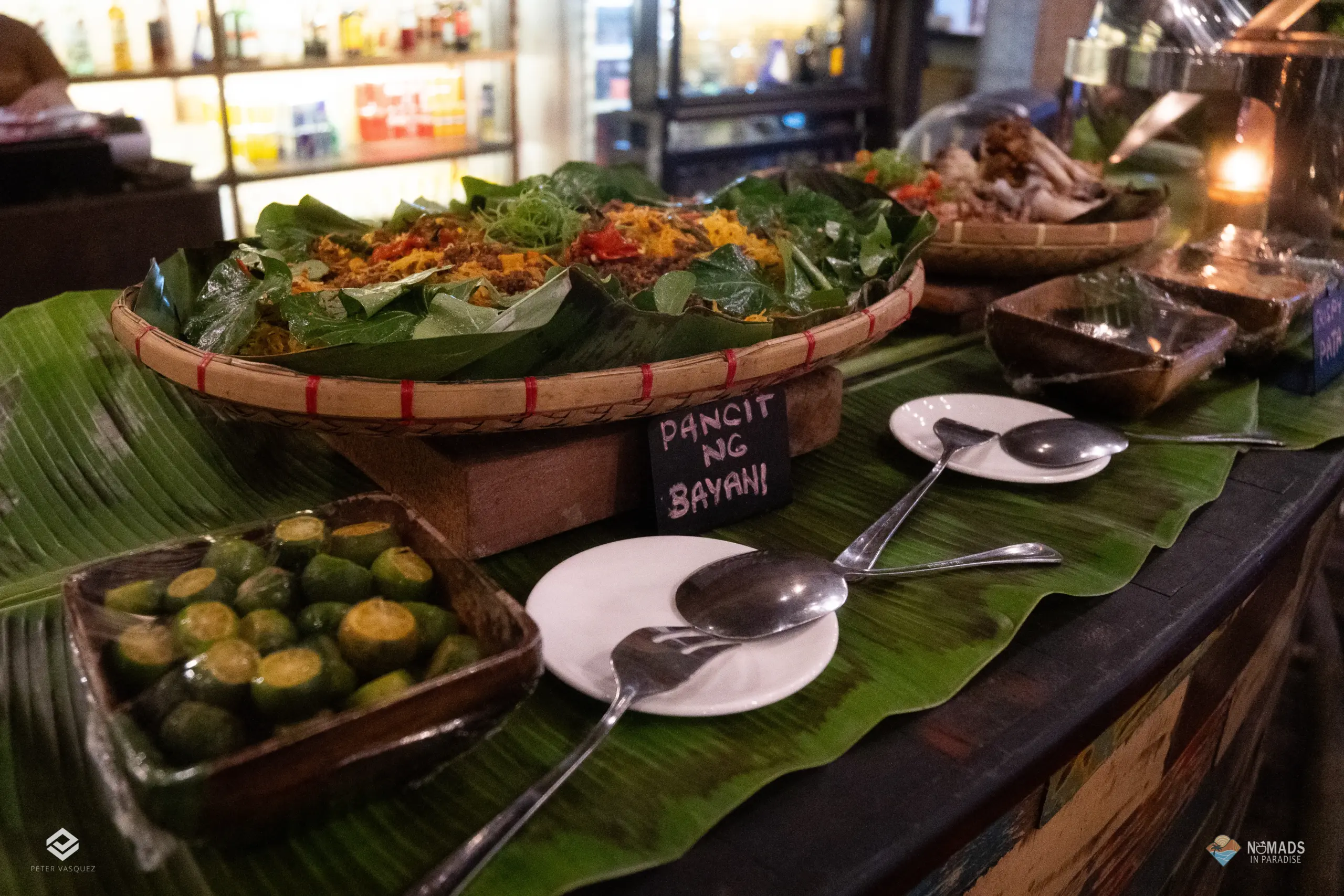 Pancit ng Bayan served on banana leaves at Filipino dinner buffet in Siargao