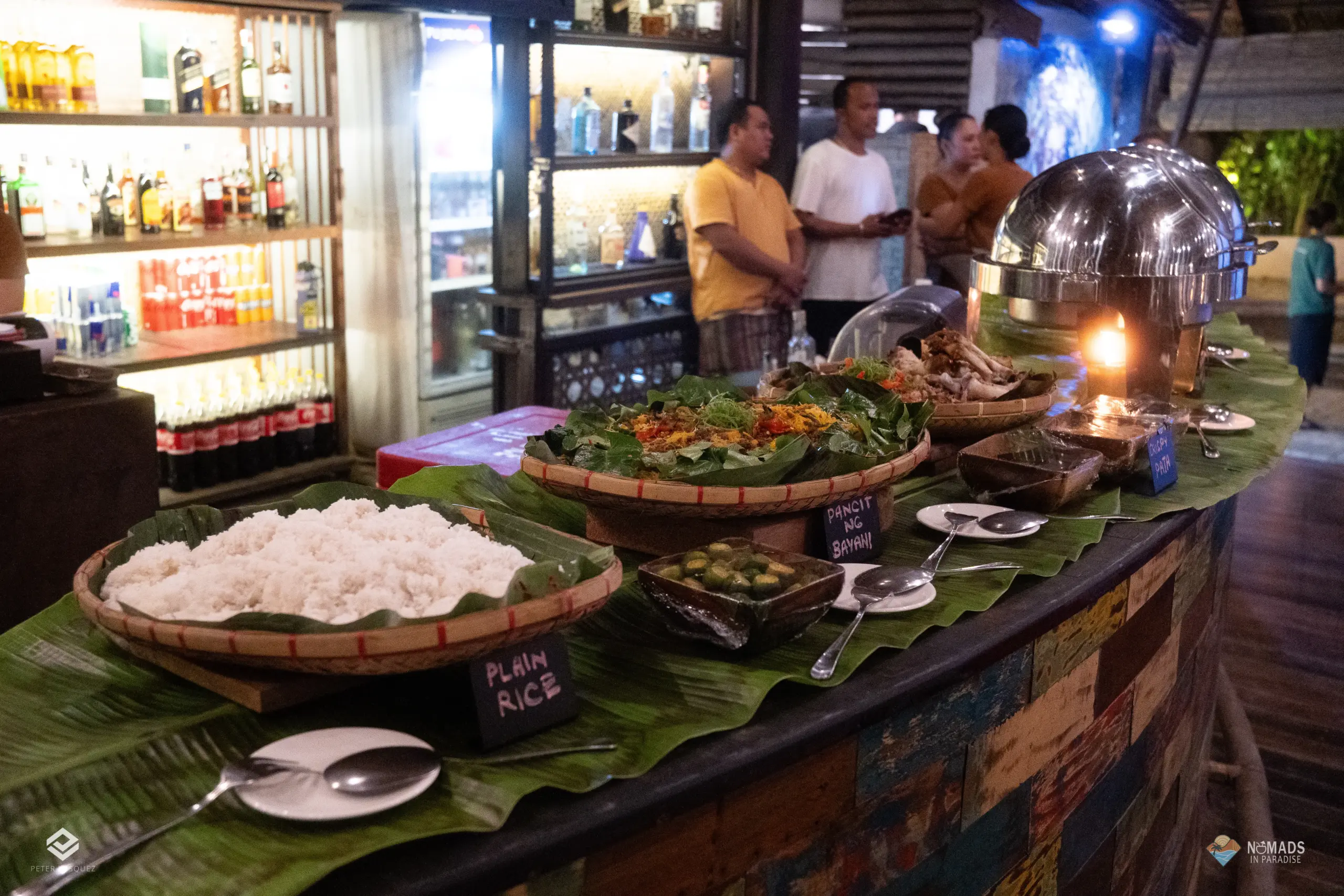 Filipino rice and pancit buffet line at tropical dinner reception