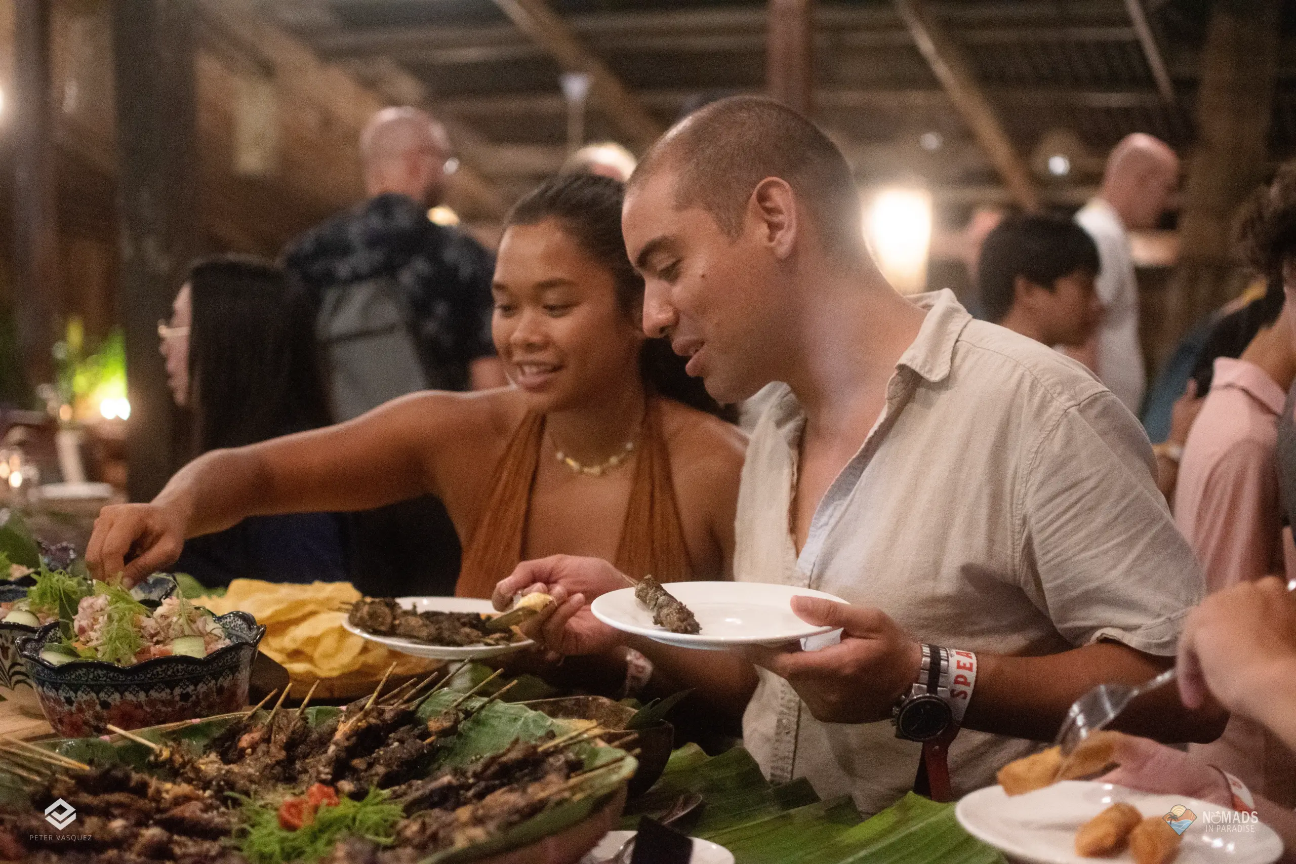 Attendees serving themselves at evening buffet during Nomads in Paradise networking dinner