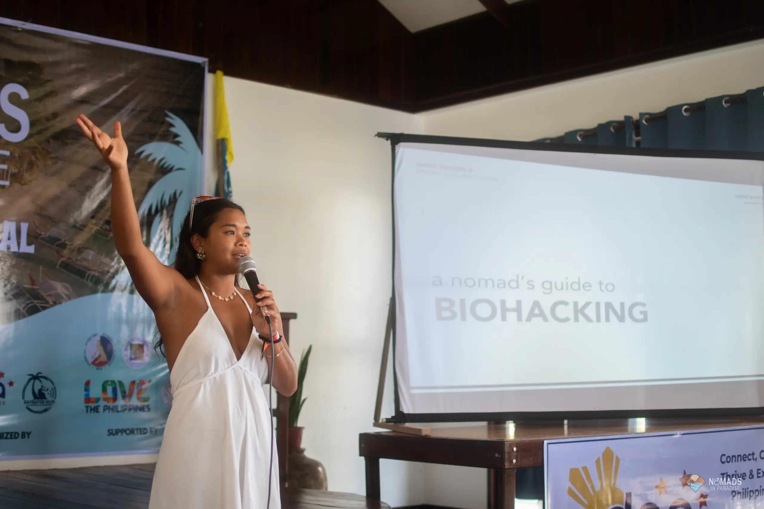 Woman presenting nomad biohacking talk on Nomads in Paradise stage